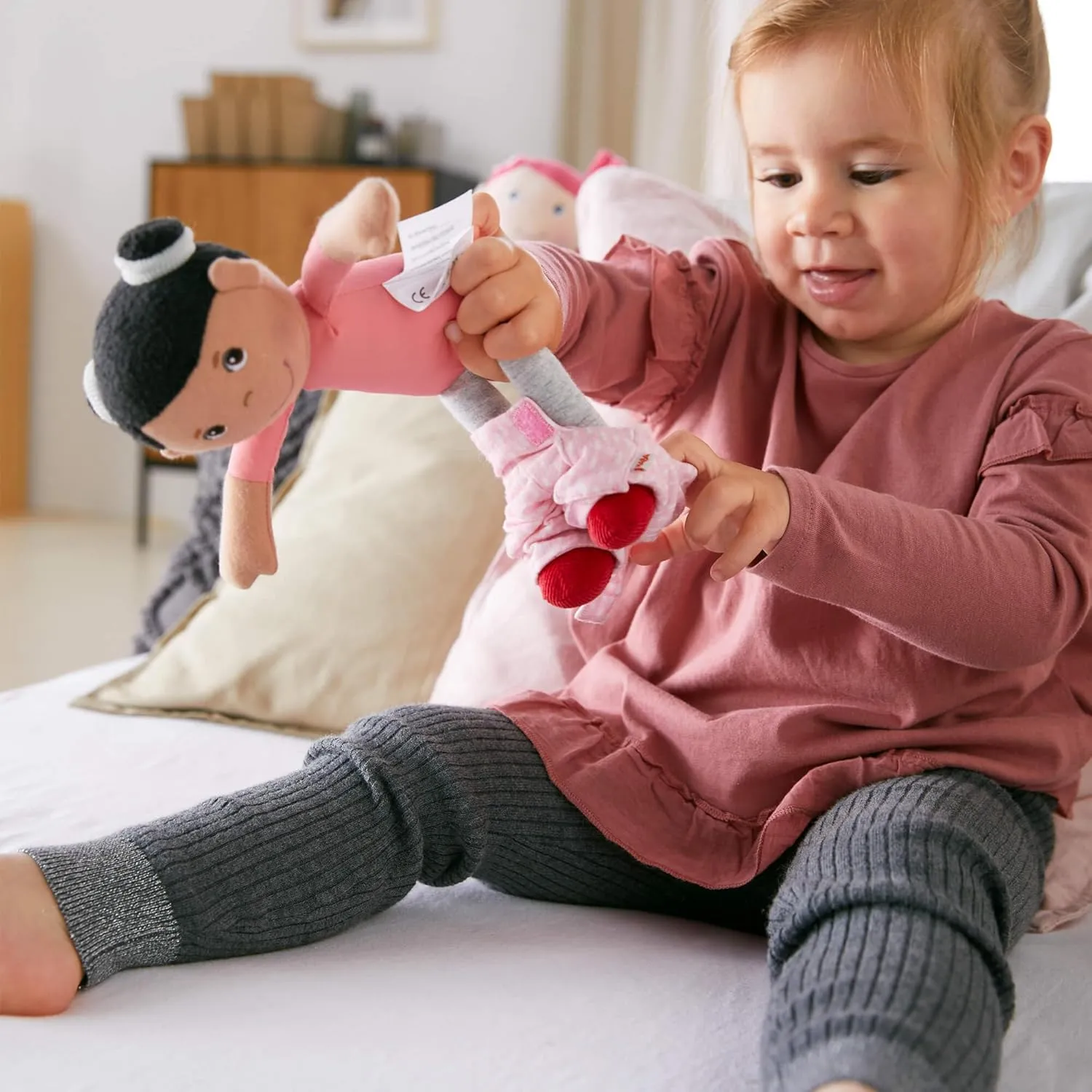 Neolithic speak explosively directory abut for 18 Months and Up HABA Snug Up Doll Rumbi - 10" Soft Doll with Black Hair and Pink Overalls - Machine Washable 