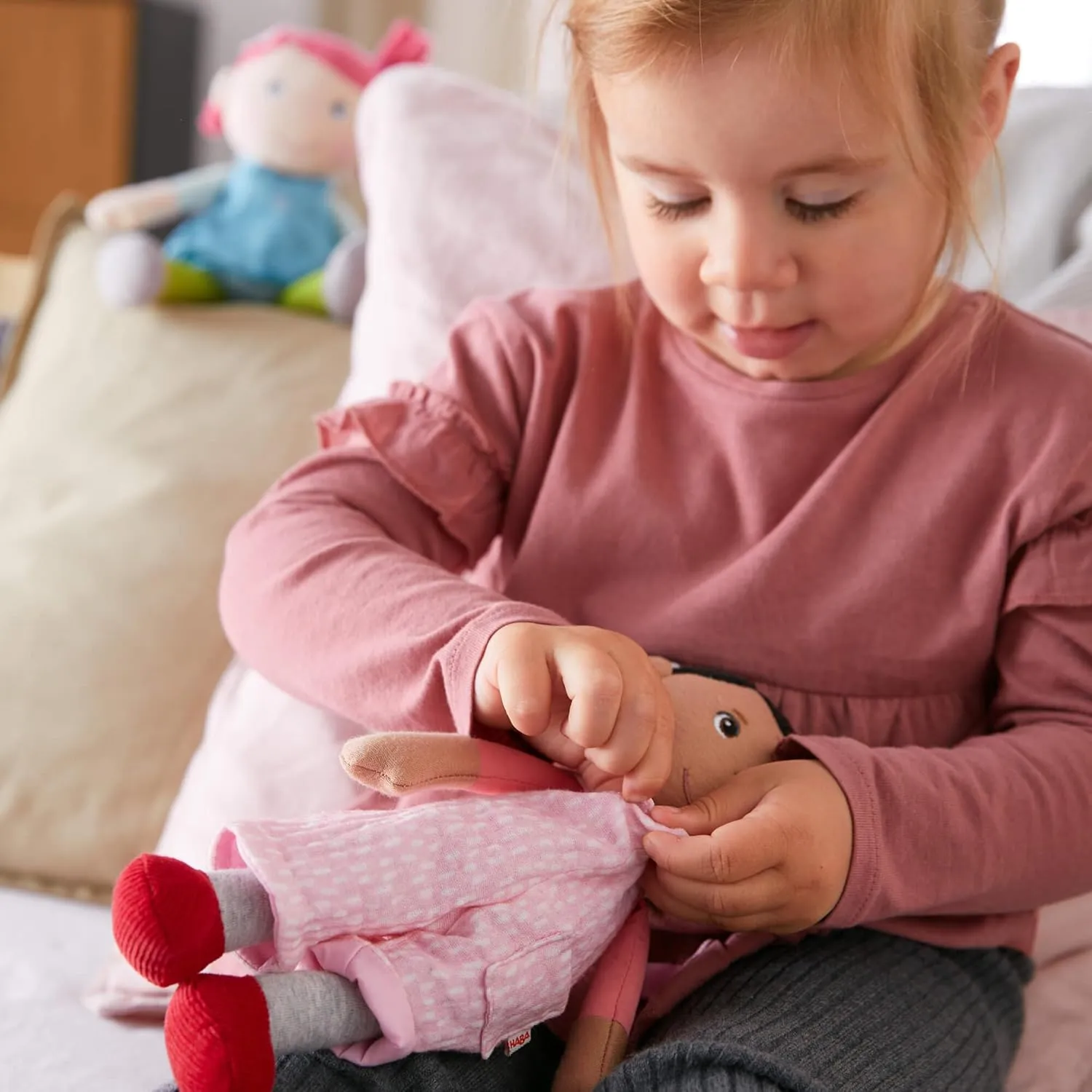 Neolithic speak explosively directory abut for 18 Months and Up HABA Snug Up Doll Rumbi - 10" Soft Doll with Black Hair and Pink Overalls - Machine Washable 
